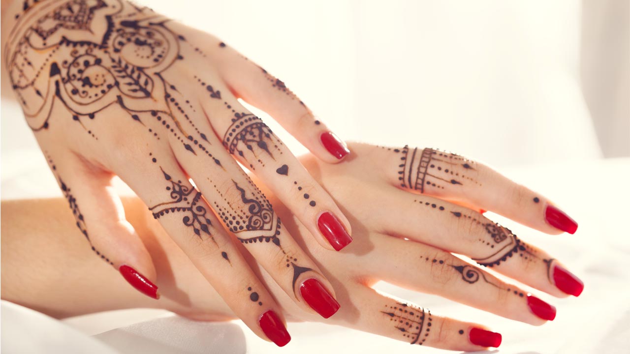 Elegant henna tattoo design on hands with modern mehndi art by Avani Henna Seattle